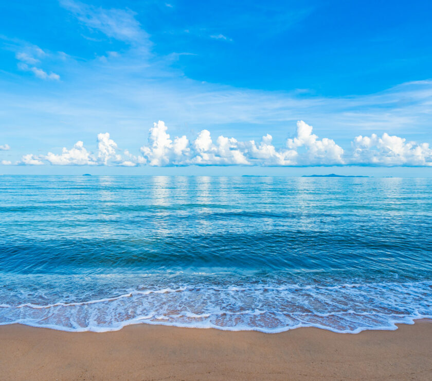 Beautiful tropical beach sea ocean with white cloud blue sky and